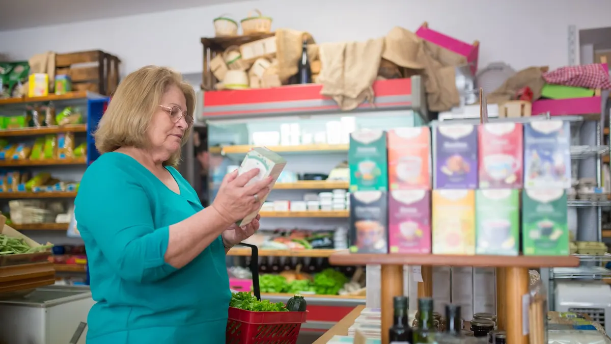 Older adult comparing two nerve supplement options